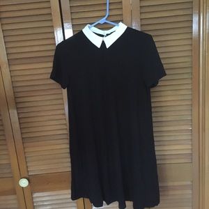 Black shirt dress with white pointy collar